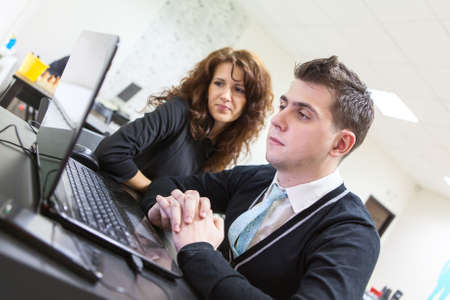 Young couple have some reading from laptop