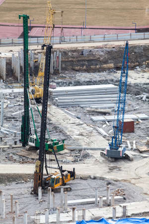 Construction site with machinery for piling into the ground