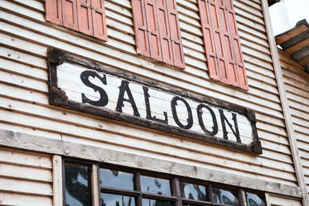 Saloon sign on building facade