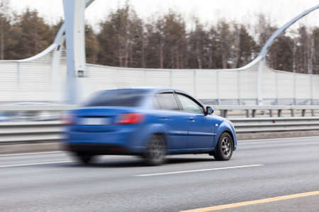 Blured car riding on road, speed wayの写真素材