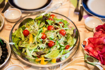 Greek salade in plate on diner tableの写真素材