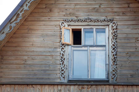 Wooden frame window in roof ridgeの写真素材