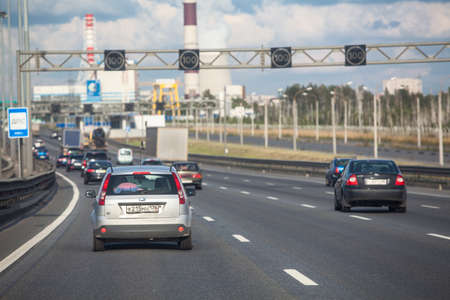 SAINT-PETERSBURG, RUSSIA - CIRCA AUGUST, 2014: Transport traffic on city beltway at summer season. City the Ring Roadのeditorial素材