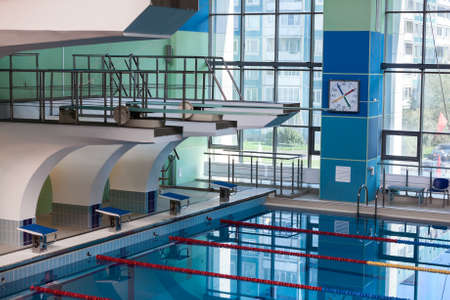 Diving boards into the water in the swimming poolのeditorial素材