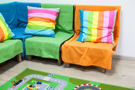 Details of interior of colorful nursery room with sofaの写真素材