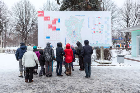 MOSCOW, RUSSIA - CIRCA JAN, 2015: People stand near VDHKh area map in Moscow Exibition Center. VDNKh...