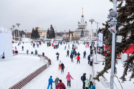 MOSCOW, RUSSIA - CIRCA JAN, 2015: People are on main city skating rink in Moscow VDNKh area. VDNKh is the all-Russian Exhibition Center with huge skating ring at winter seasonのeditorial素材