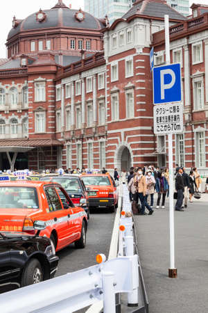 TOKYO, JAPAN - CIRCA APR, 2013: Taxicab are on the parking area near the Tokyo undeground station. Land transport is in center of the cityのeditorial素材