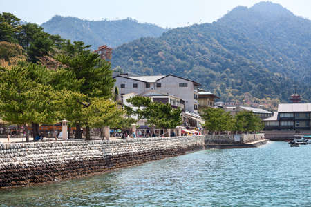 HATSUKAICHI, MIYAJIMA, JAPAN - CIRCA APR, 2013: City embankment and sea shore are in Hatsukaichi town. The Miyajima Island (Itsukushima), Japanのeditorial素材