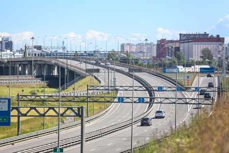SAINT-PETERSBURG, RUSSIA - CIRCA JULY, 2014: Vehicles drive on exit to the Saint-Petersburg city encircling highway. The federal public ringroad around the cityのeditorial素材