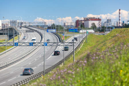 SAINTPETERSBURG RUSSIA CIRCA JULY 2014: Car drives on exit to the SaintPetersburg city encircling highway. The federal public ringroad around the cityのeditorial素材