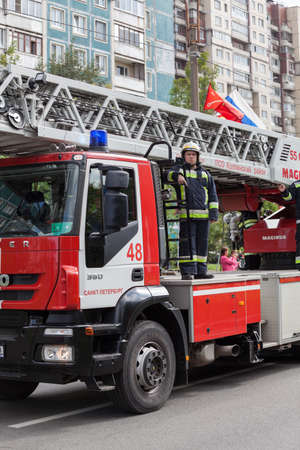 KOLPINO, SAINT-PETERSBURG, RUSSIA - CIRCA SEPTEMBER, 2014: Firetrucks take part in the Parade of the city day celebration. Procession on the Kolpino town streetsのeditorial素材