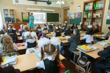 ST. PETERSBURG, RUSSIA - SEP, 1, 2014: First-grade students and teacher are in school classroom at first lesson. Children go back to school at first time in Septemberのeditorial素材