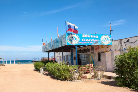HURGHADA, EGYPT - CIRCA NOV, 2015: Empty diving and scuba center is on sandy beach resort. Russian flag is at the roof. Entertainment is on the Hurghada resortのeditorial素材