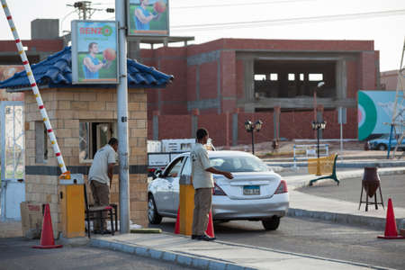 HURGHADA, EGYPT - CIRCA NOV, 2015: The checkpoint with barrier and guards is on the Senzo Mall parking lot. Safety precautions are in public places in Egyptのeditorial素材