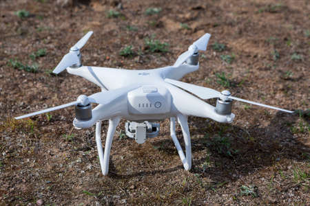 MOSCOW, RUSSIA - CIRCA MAY, 2016: White quadrocopter Dji Phantom 4 is on land. Phantom 4 is a last...