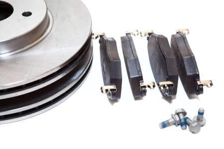 Set of new brake pads and discks isolated on white backgroundの写真素材