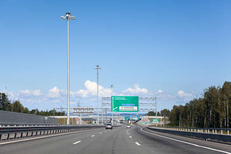 Wide multilane Ring Road with direction signs at summer season, highway around the city, St....