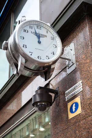 HELSINKI, FINLAND - CIRCA SEP, 2016: It is almost twelve hours on facade clock on street Aleksanterinkatu. Aleksanterinkatu is famous street in the center of Helsinki cityのeditorial素材