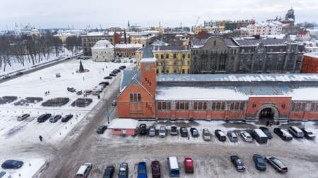 VYBORG, RUSSIA - CIRCA JAN, 2017: Top view at building of central market with parking lot. It is located on the Market Square in center of town. Vyborg is town in Leningrad Oblast. Aerial viewのeditorial素材