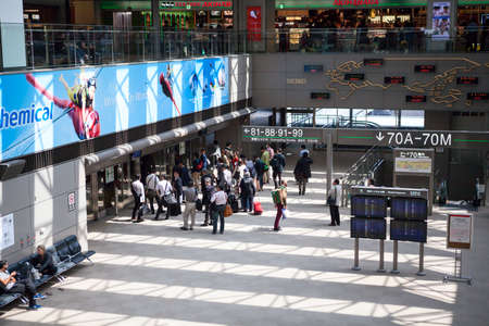 NARITA, JAPAN - CIRCA APR, 2013: Passengers wait for connecting shuttle for reaching a hub for a...