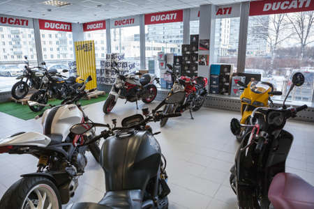 ST. PETERSBURG, RUSSIA - CIRCA FEB, 2017: New street and scrambler motorcycles of Ducati brand are on sale in motorcycle store. Official dealership of Kawasaki and Ducati is in cityのeditorial素材