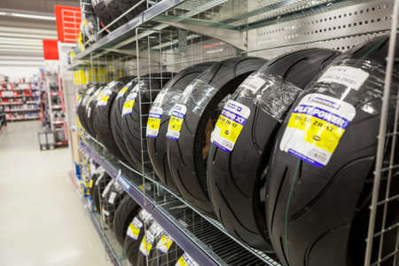 HELSINKI, FINLAND - CIRCA DEC, 2016: Shelves with racing motorcycle tires are in motorbike store....
