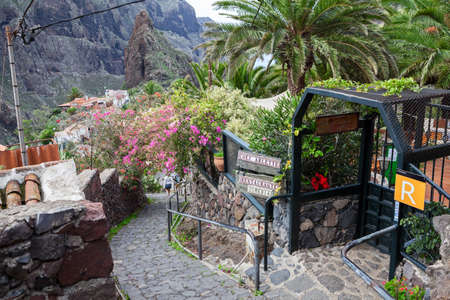MASCA, TENERIFE, CANARY, SPAIN - CIRCA JAN, 2016: Entrance in small restaurant is in Masca village. Paved stairway passes through the dwelling houses. Masca is a small village with popular hiking trailのeditorial素材