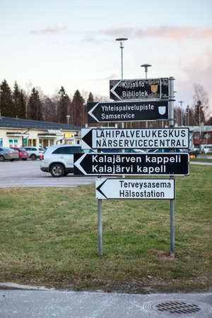 KALAJARVI, FINLAND â€” CIRCA, DEC, 2015: Direction signs to library, to church and hospital are...
