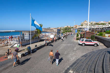 COSTA ADEJE, TENERIFE, SPAIN-CIRCA JAN, 2016: Blue Flag indicates high environmental and quality standards of the Playa Fanabe beach. It is located on the south of Tenerife island. The Playa Fanabe is a biggest city beachのeditorial素材
