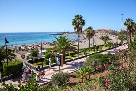 LOS CRISTIANOS, TENERIFE, CANARY, SPAIN - CIRCA JAN, 2016: View at the Playa de Las Vistas sandy beach with pathway for walking. Beaches are on Atlantic ocean in Los Cristianos cityのeditorial素材