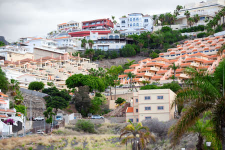 COSTA ADEJE, TENERIFE, CANARY, SPAIN-CIRCA JAN, 2016: Residential area is on the slope of the mountain in the city of Costa Adeje. South of Tenerife Islandのeditorial素材