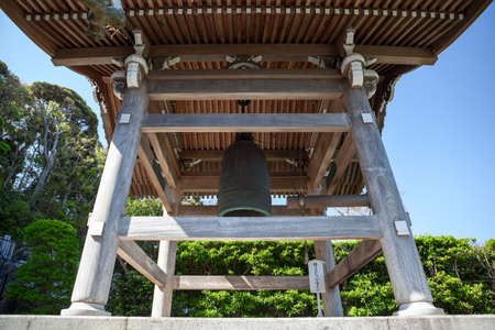 KAMAKURA, JAPAN â CIRCA APR, 2013: Wooden bell-tower with large bell is in inner courtyard of Hasedera Shrine. Temple is near the village of Hase in the Kanagawa prefectureのeditorial素材