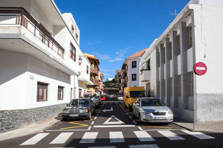 GARACHICO, TENERIFE, SPAIN-CIRCA JAN, 2016: Low rise and renovated beautiful houses with large balconies are in central narrow streets. The Garachico is an ancient town on the northのeditorial素材