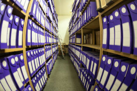 Wide angle view at archive room and storage with papers documents and blueprints