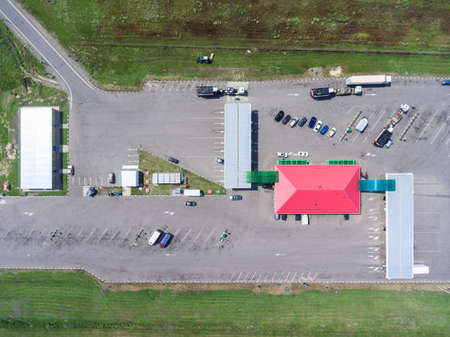 Petrol station on motorway, top view at entrance, resting area and main building with storeの写真素材