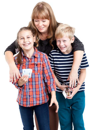 Mother trying to take off her children pocket money, kids holding cash and laughing, isolated on a white backgroundの写真素材