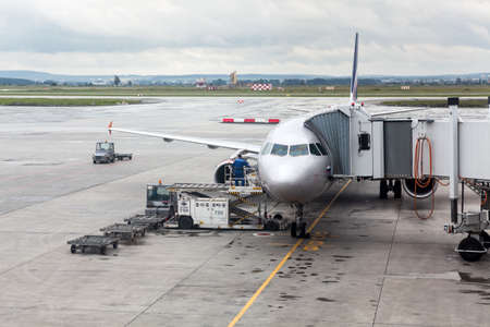 EKATERINBURG, RUSSIA-CIRCA JUL, 2015: Aircraft by Aeroflot Airlines is connected to an enclosed,...