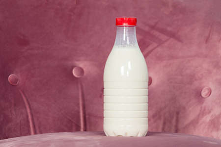 Plastic bottle with milk, one litre volume, red capの写真素材