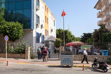 Alanya, Turkey-circa Oct, 2020: Building of the Alanya Land Registry and Cadastre Offices. People wait their turn outdoor due pandemic. It is works in public administration activitiesのeditorial素材