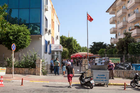 Alanya, Turkey-circa Oct, 2020: Building of the Alanya Land Registry and Cadastre Offices. People wait their turn outdoor. It is works in public administration activitiesのeditorial素材