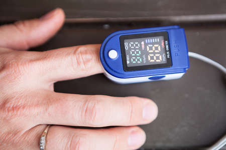 Close up view at an oximeter for monitoring peripheral oxygen saturationの写真素材