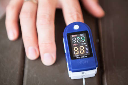 Screen of an oximeter while monitoring peripheral oxygen saturation, close up viewの写真素材