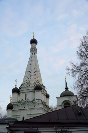 White Orthodox Church with Golden Crosses Against Blue Skyの写真素材