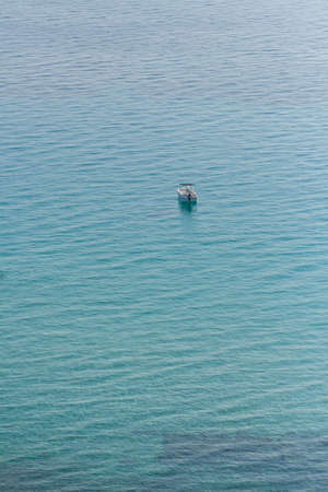 Lonely boat in the seaの写真素材