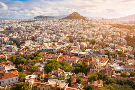 The view out over the city of Athens in the sunlightの写真素材