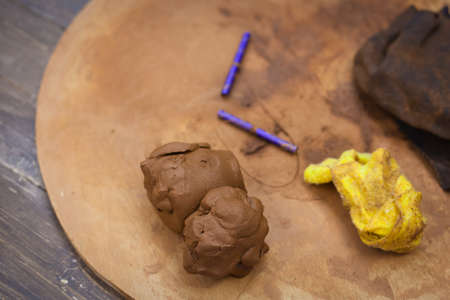 Materials and tools for pottery. Clay in the Studio. String for cutting the clay with the Potter's wheel.の写真素材