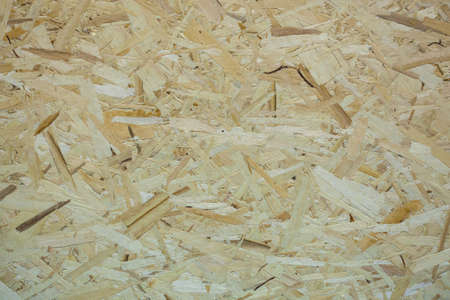 OSB plate. The texture of the OSB boards. Structural panel of compressed wood chips for walls, floors, and ceilings.の写真素材