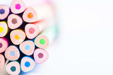 Close-up of colored pencils on a light background. Round pencils on a white background. Blurred wooden pencils.の写真素材