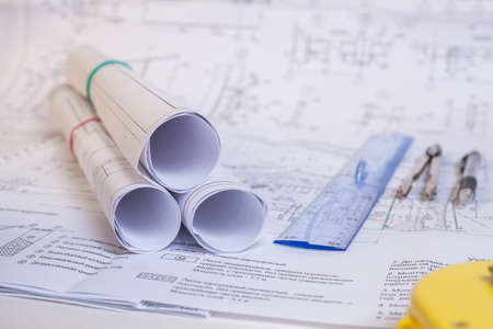 Design documentation is on the table. Tool for designers. Rolls of drawings.の写真素材